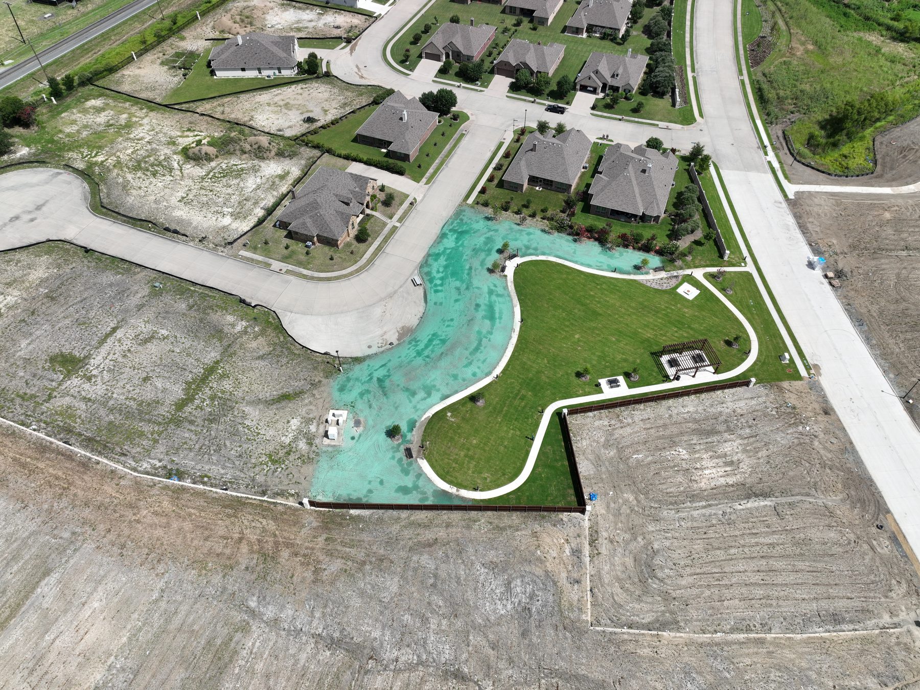 Aerial view of the completed amenity pool and surrounding homesites at Clearview Ranch in Royse City, Texas