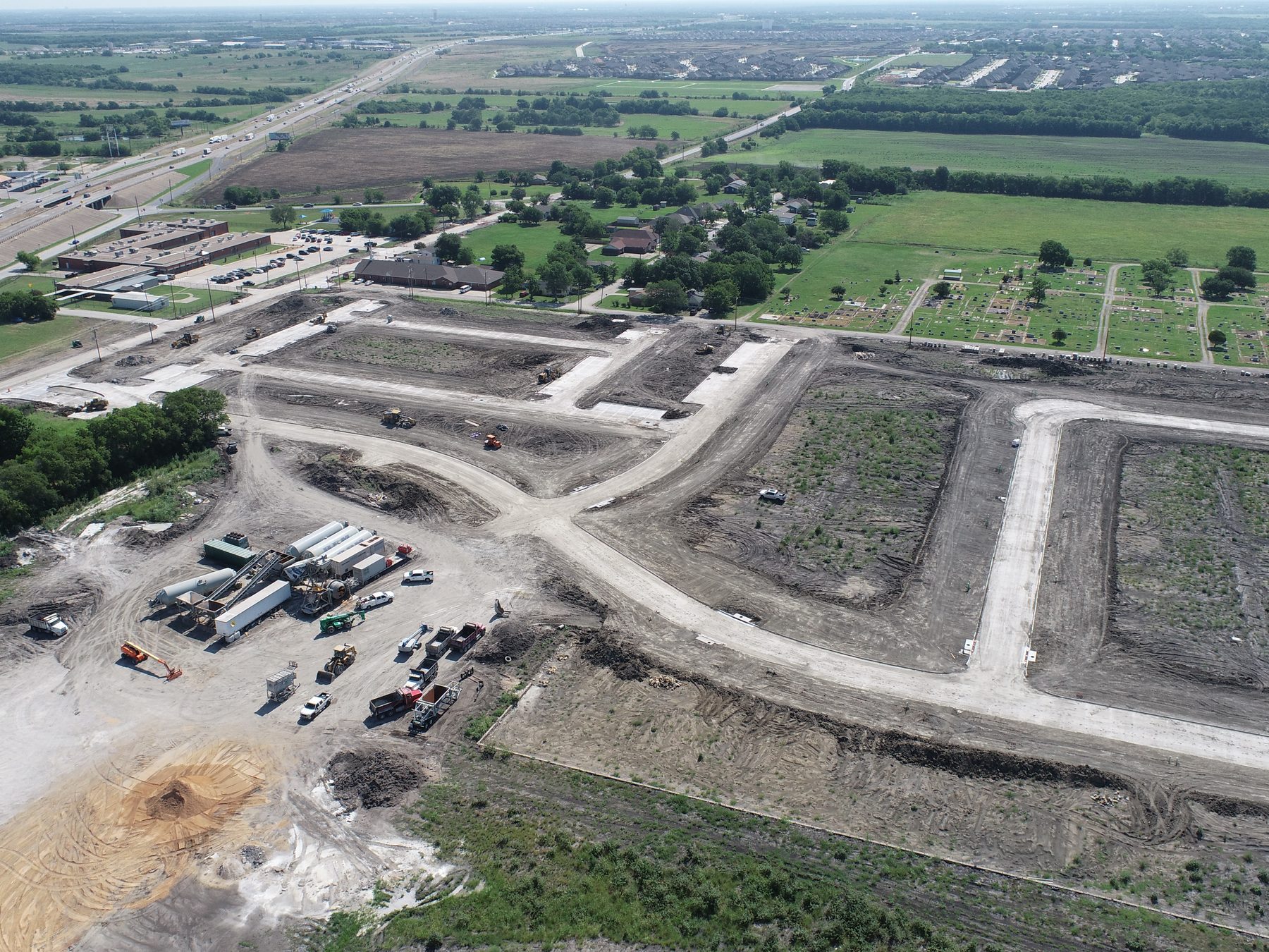 Aerial view of the amenity center approach and surrounding streets at Liberty Crossing in Royse City, Texas